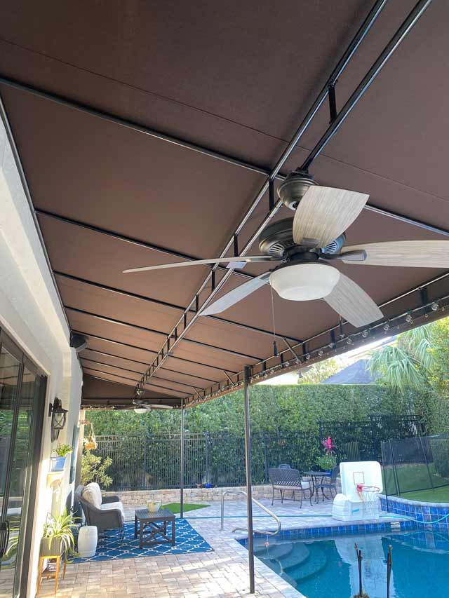 Full length patio awning with power and lighting.